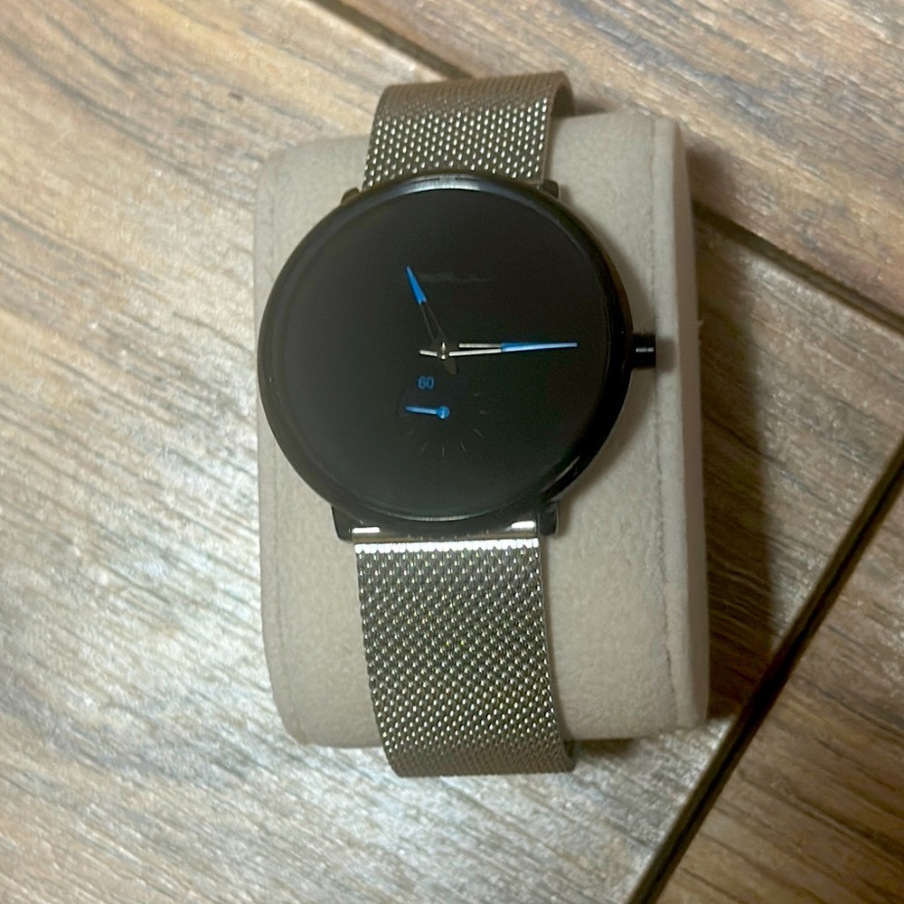 Black and Silver Men's CRRJU stainless steel watch.